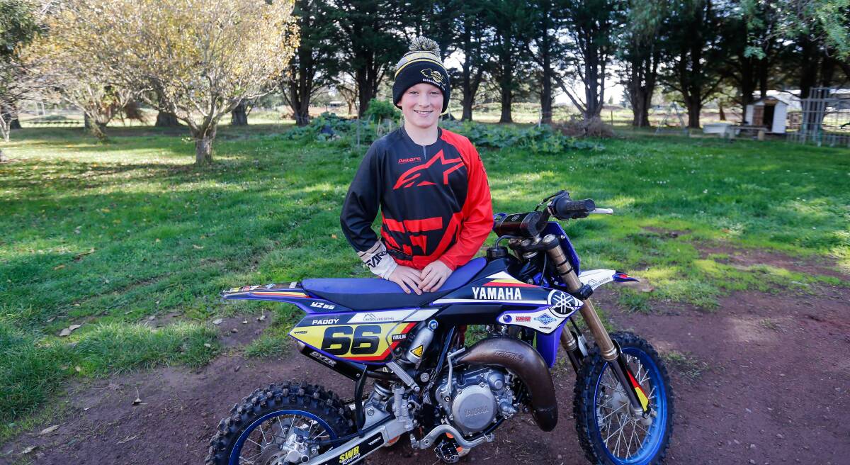 Going places: Talented motocross rider Paddy Lewis, 11, on his family's property. Picture: Anthony Brady