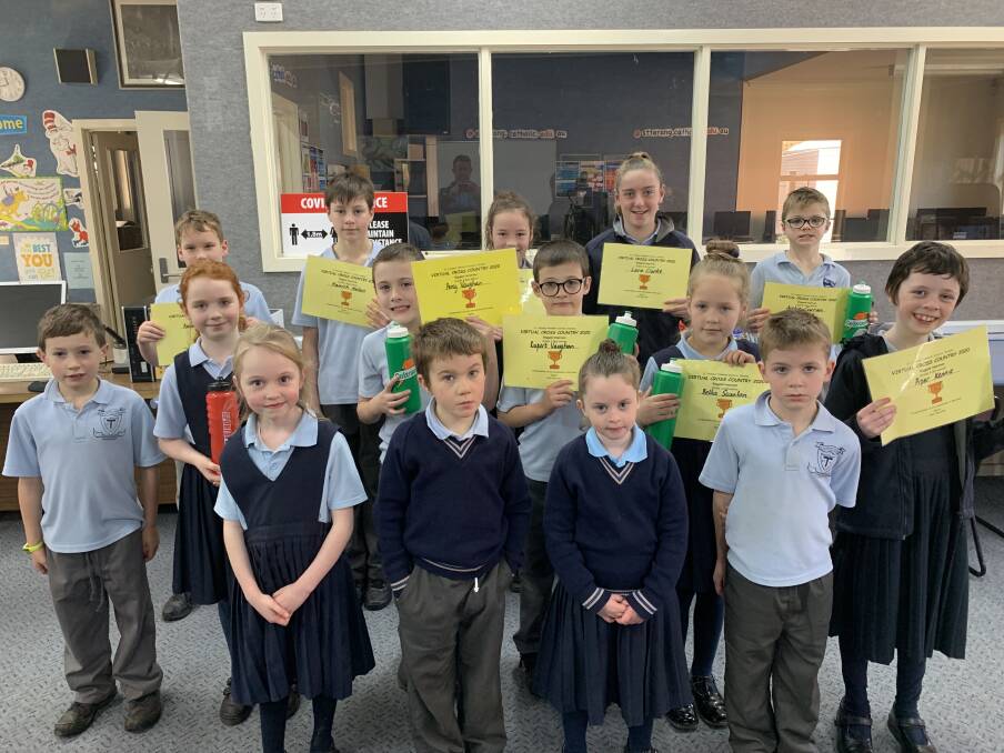 Congratulations: These St Thomas' Primary School students were the biggest improvers for their age group in the school's virtual cross country. 