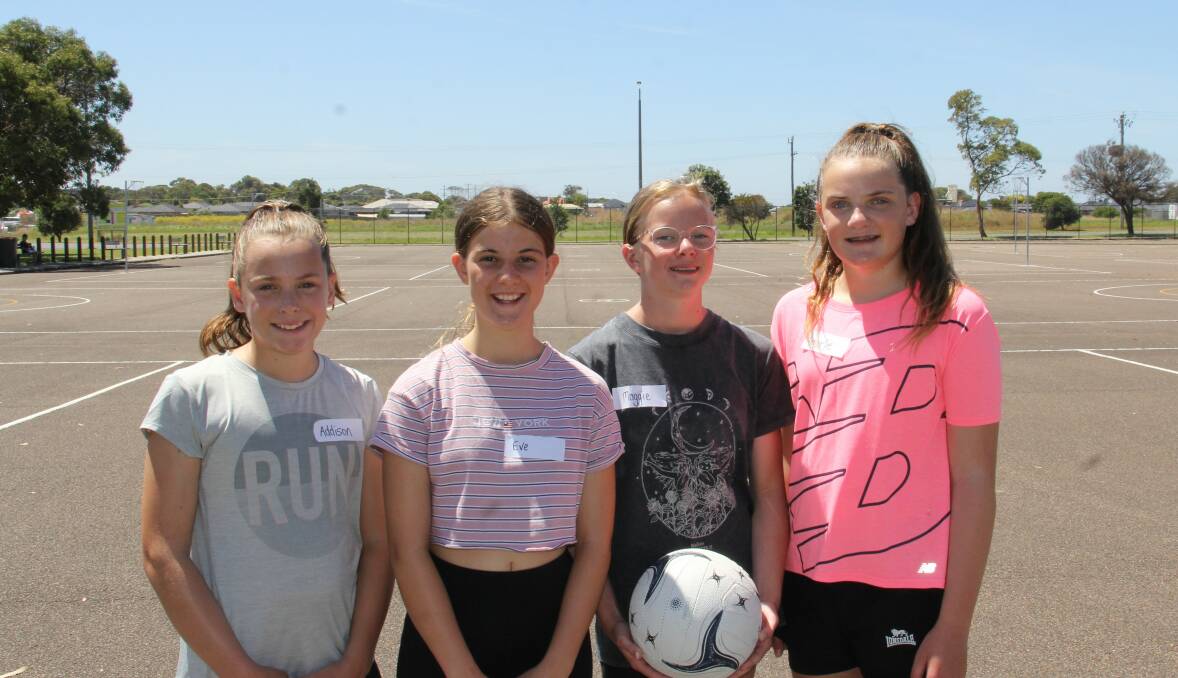 Back on court: Addison Conheady, Eve Lake, 12, Maggie Drake, 12, and Amarlie Conheady had a blast at the netball clinic. Picture: Brian Allen
