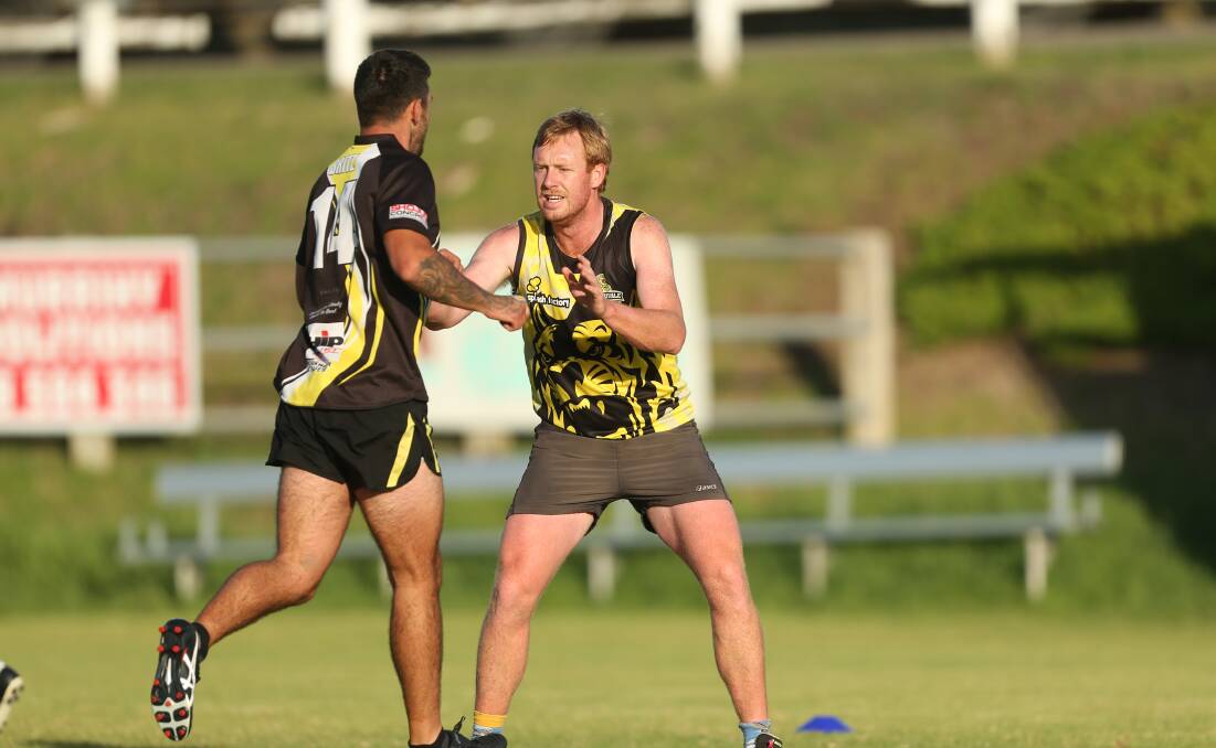 Back at Tigerland: Boom recruit Manny Sandow, who returned from South Warrnambool during the off-season, and Josh Britton in a competitive drill at football training. Picture: Chris Doheny 
