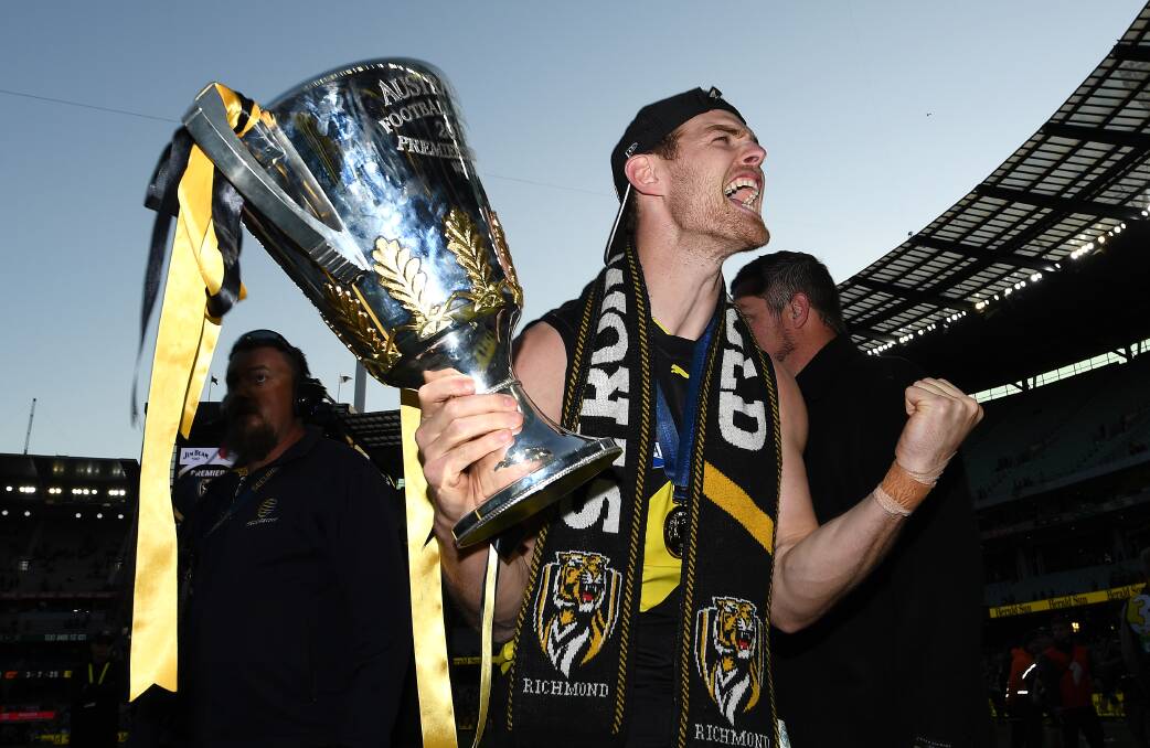 Sweet success: Tatyoon export and Richmond defender David Astbury celebrates with the 2019 premiership cup. Picture: Getty Images