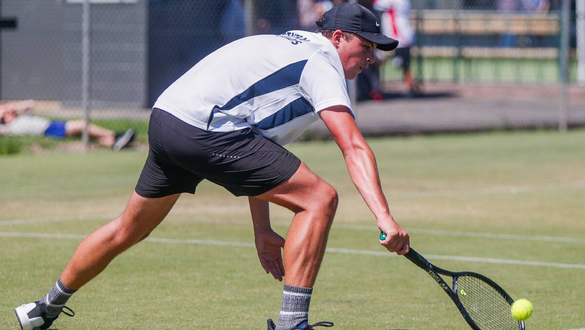 Athletic: Griffin Andrews lunges for the ball in the boys 18 and under singles at Warrnambool Lawn Tennis Club on Friday.