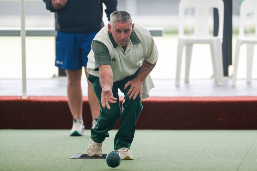 Displaying leadership: City Memorial Gold skipper Vince Moloney sends a bowl down the green.