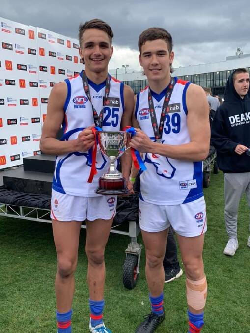 Young guns: (l-r) South Warrnambool's Jamarra Ugle-Hagan and his Oakleigh Chargers teammate Reef McInnes after winning the NAB League decider. 