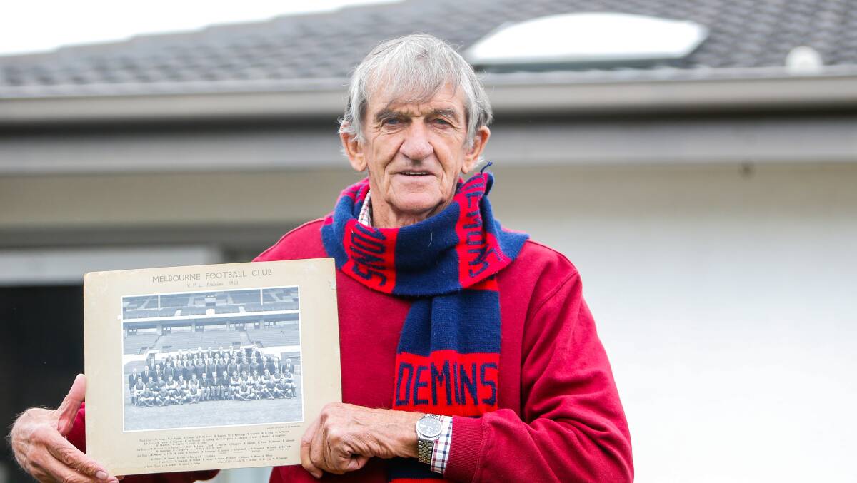 GO DEES: Warrnambool's Len Mann with a photo of Melbourne's 1960 premiership team. He was the ruckman in the grand final triumph against Collingwood. Picture: Anthony Brady 