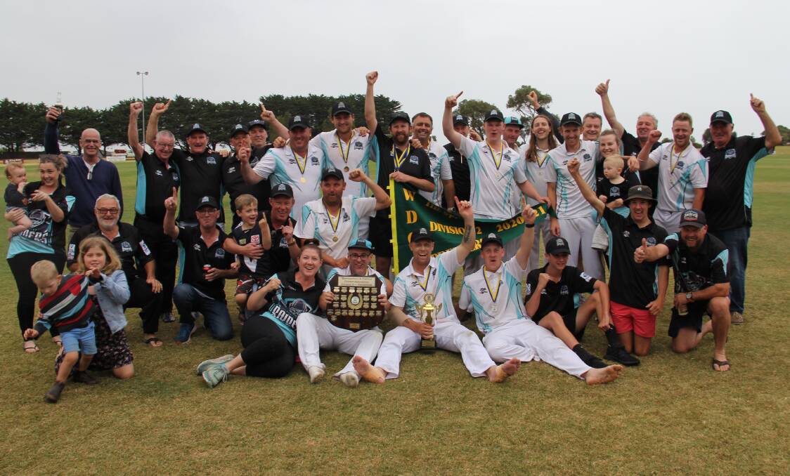 Club effort: Northern Raiders players and supporters celebrate the club's division two premiership win over Dennington on Sunday. Picture: Brian Allen