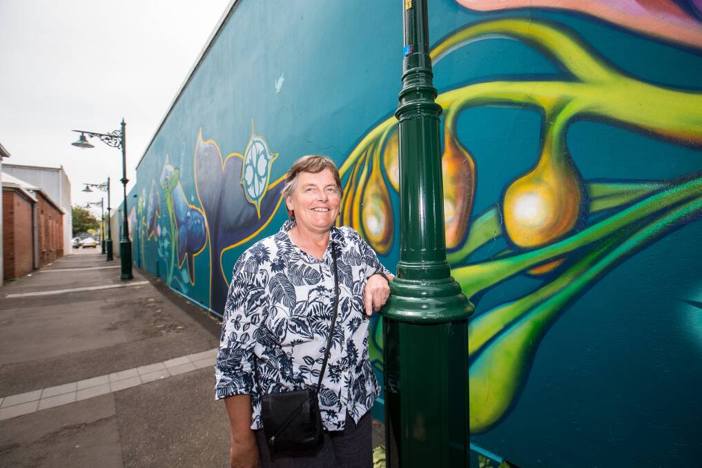 Sea life: Warrnambool street art tour guide Claire Norman at the Timor Walk mural. Picture: Christine Ansorge
