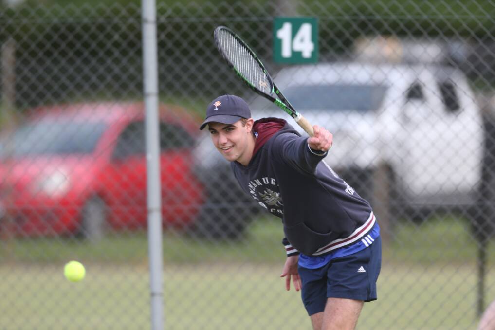 LOADS OF FUN: Joseph Mahony hits the ball during last year's Morton Cup at Warrnambool Lawn Tennis Club.