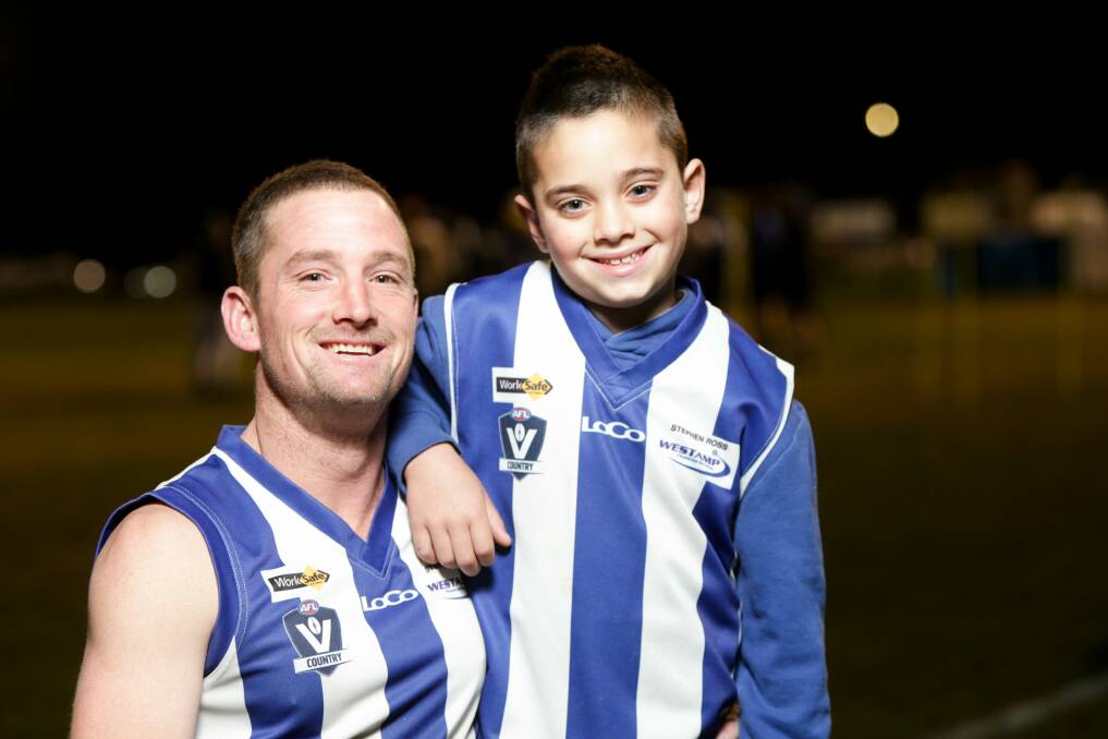 Family: Russells Creek midfielder Sam Grinter with his son Chayce, 8, at training this week. Picture: Chris Doheny 