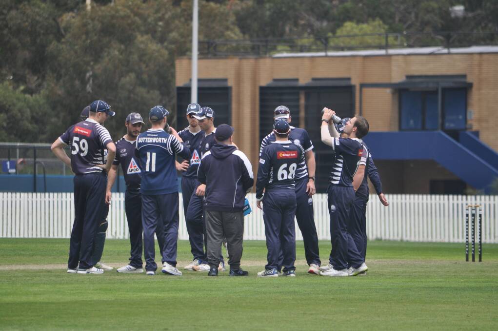 Well done: Nirranda product Brody Couch celebrates with his Geelong teammates after taking a wicket against Melbourne University on Saturday.