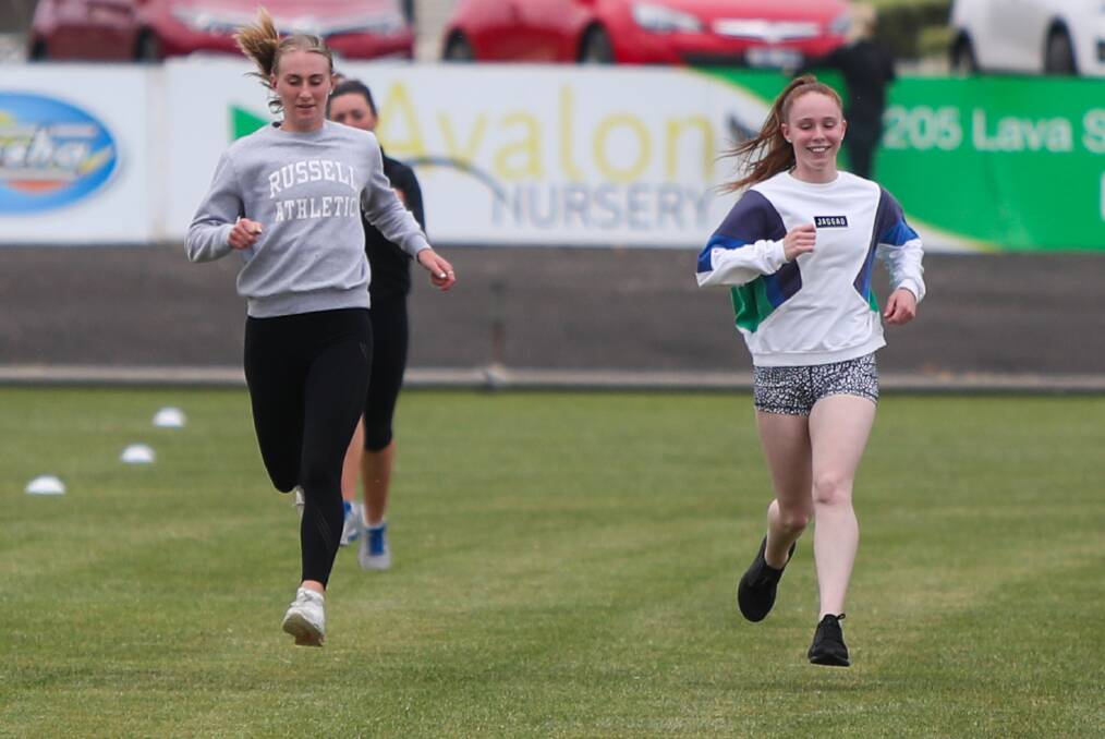 Strong sprinters: Warrnambool's Layla Watson and Grace Kelly at running training. Picture: Morgan Hancock 