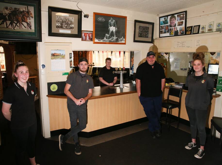 THE TEAM: Allansford Hotel employees Hannah Garner, Roy Oakley, owner Diana McLean, Brett Kampman and Thalia Coates have continued to provide takeaway meals and drinks. Picture: Mark Witte