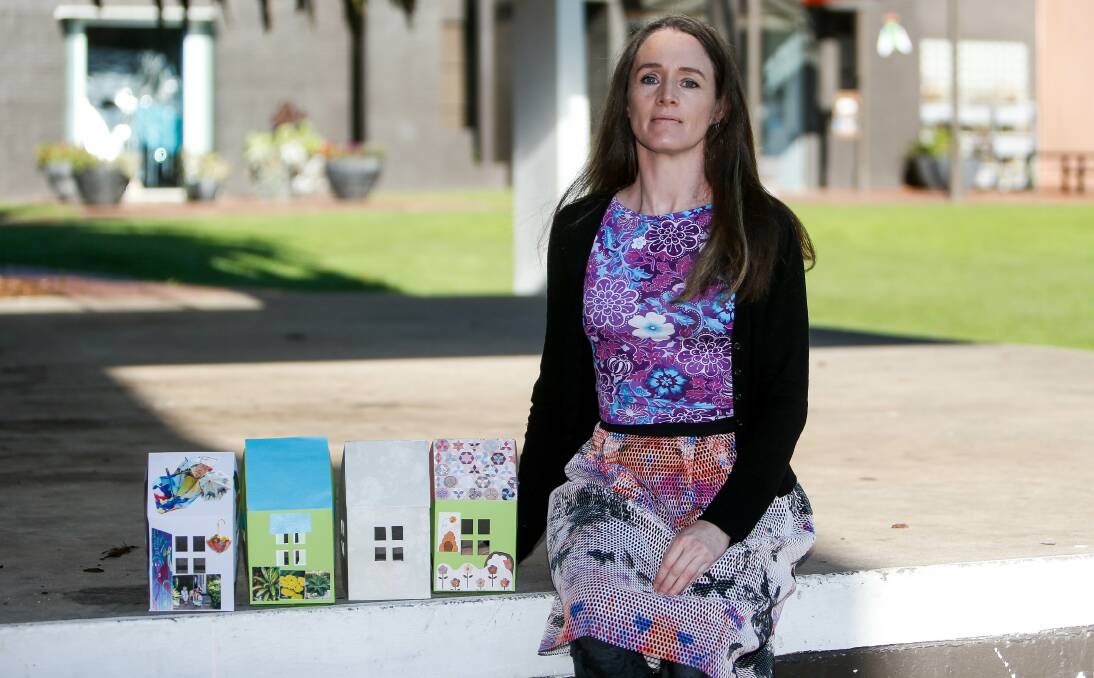 SAFEHOUSE: Becky Nevin Berger, the Elder Abuse Prevention Project Worker for South West Victoria, with paper houses promoting the Warm Safe Home Project. Picture: Anthony Brady