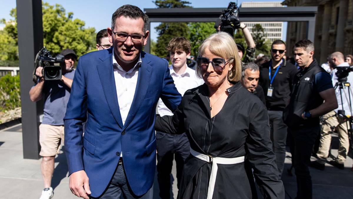 Victorian Premier Daniel Andrews with his wife Catherine after announcing his resignation. Picture by AAP Image/Diego Fedele