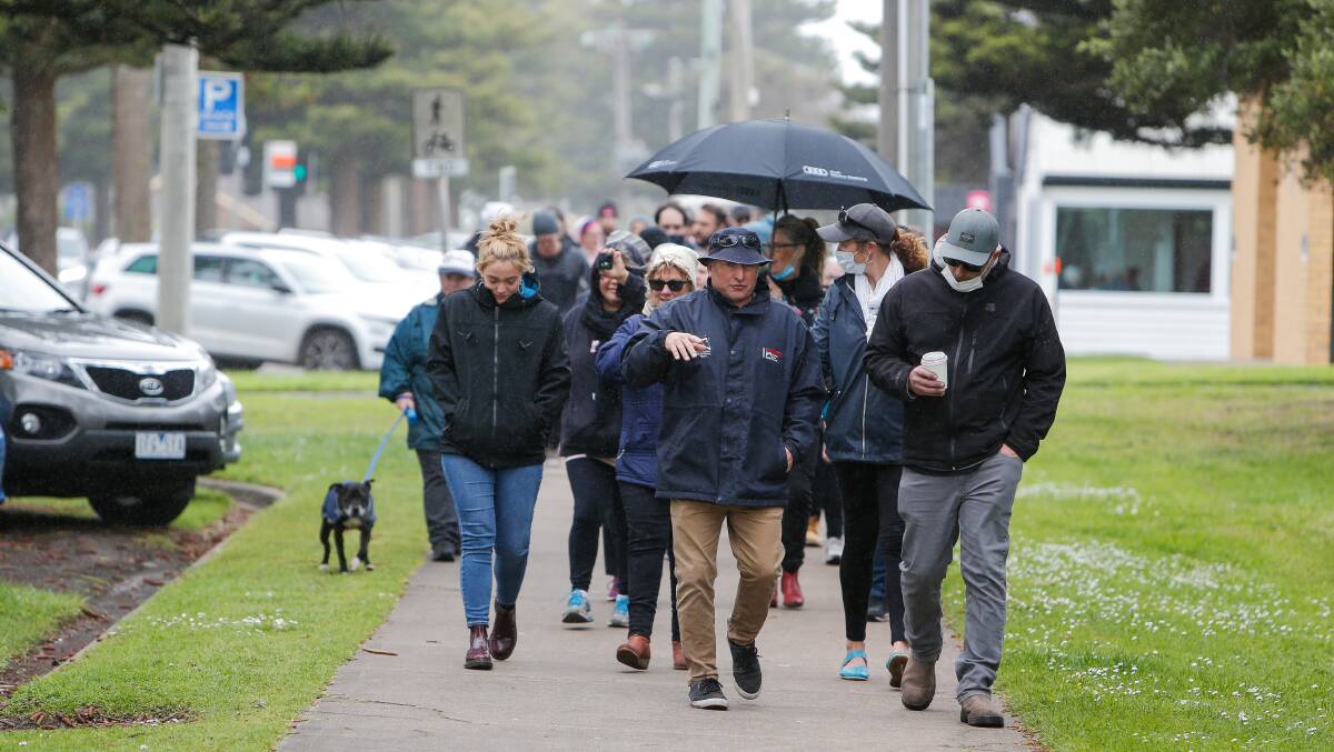 ON THE MOVE: Protesters walk to the breakwater. Picture: Anthony Brady