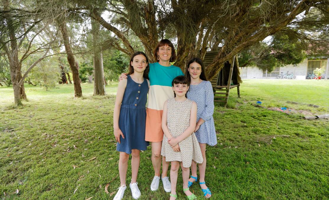 SEW SUCCESS: Allansford's Suz Seniore and her daughters Isabella, 12, Juliette, 10, and Emily, 8, in dresses designed and made by Mrs Seniore, she has created a huge online following with her work. Picture: Anthony Brady