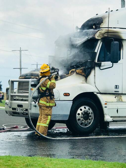 EMERGENCY: A firefighter works to extinguish a truck fire on Raglan Parade. Picture: Supplied.