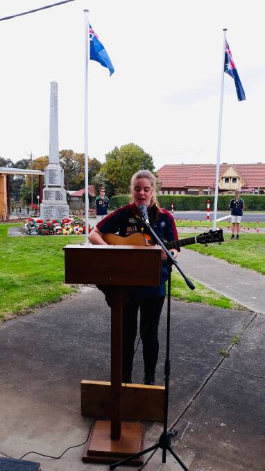 MOVING: Cobden's Hayley Wason sings the national anthem at the Cobden service provided by her family. Picture: Supplied