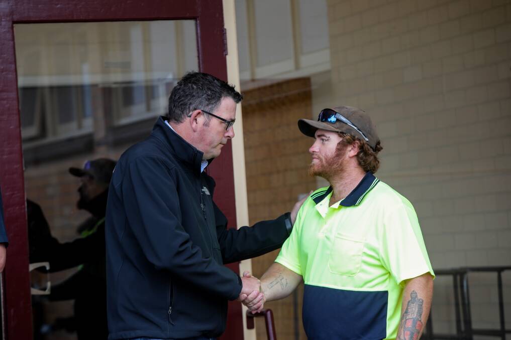 In 2018 Premier Daniel Andrews talks to Ellingamite North resident Nathan Dixon. Mr Dixon evacuated with his family on Saturday night, and the fires burnt everything on his property.