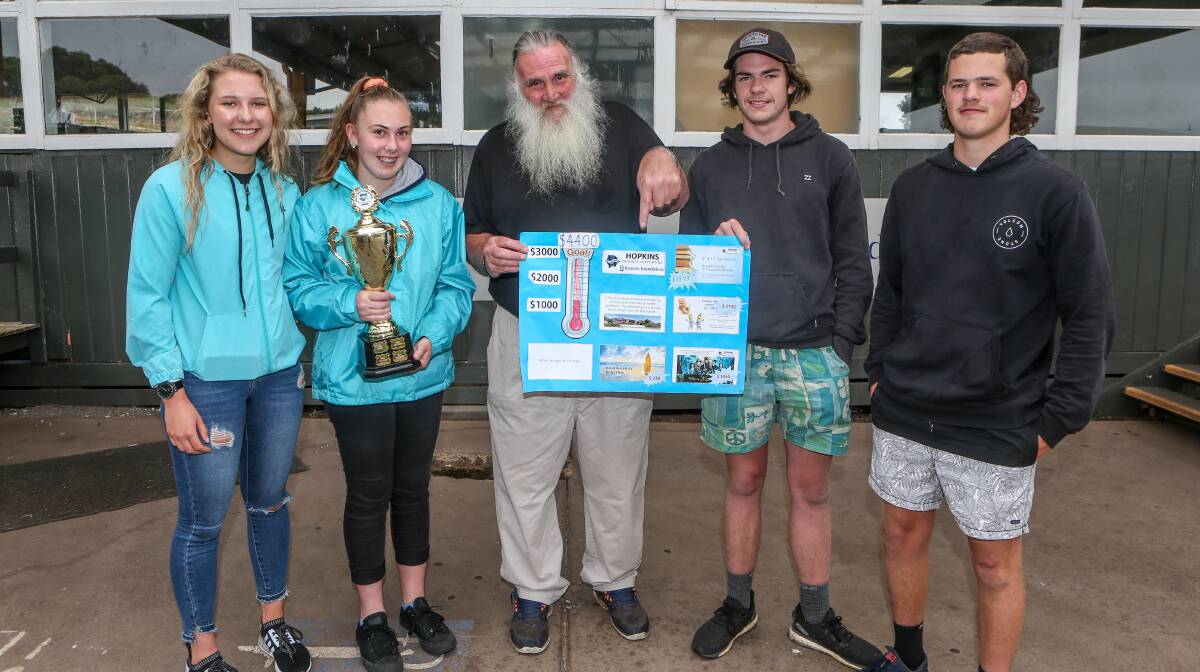 TEAM WORK: Warrnambool College students Shearna Russell, 16, Hannah Garner, 16, Flynn Gurry, 17, and Jye Wilson, 16, donated $4400 to Francis Foundation's Peter McMahon. Picture: Christine Ansorge.