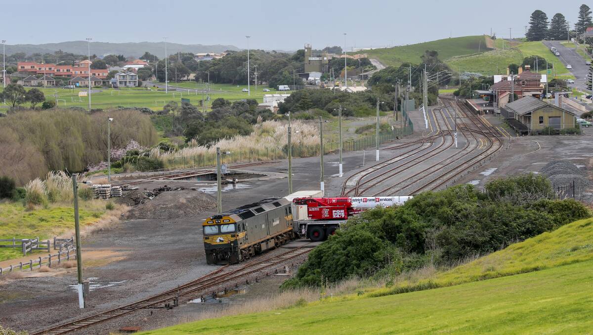 LIFT: A crane arrives to lift the Pacific National freight train back onto the tracks. Picture: Christine Ansorge