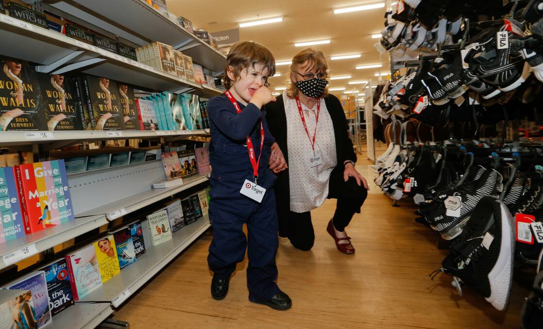 AT WORK: Marshall Hayhoe, 5, was made the official Target store inspector by staff member Ros Stewart. Picture: Anthony Brady