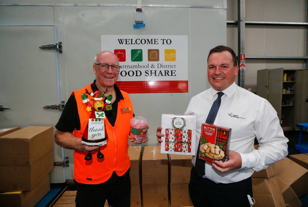 SUPPORT: Dedy Friebe from Food Share and Wayne Robertson (chief operating officer at Westvic Staffing), who have donated to Food Share. Picture: Anthony Brady