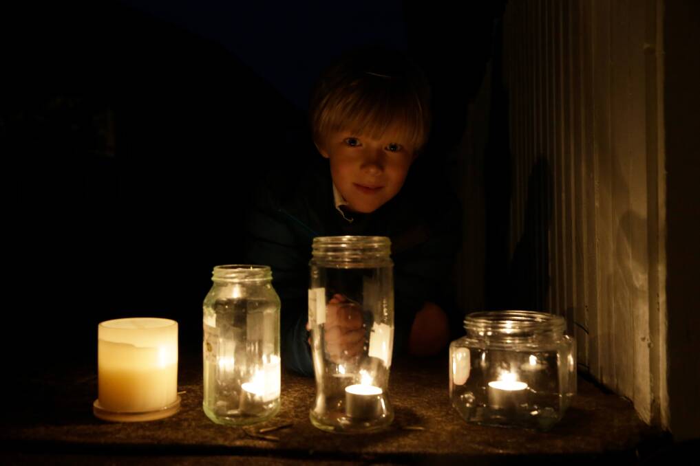 RESPECT: Warrnambool's Leopold Forynski, 7, outside his home with candles they put together to commemorate Anzac Day. Picture: Mark Witte