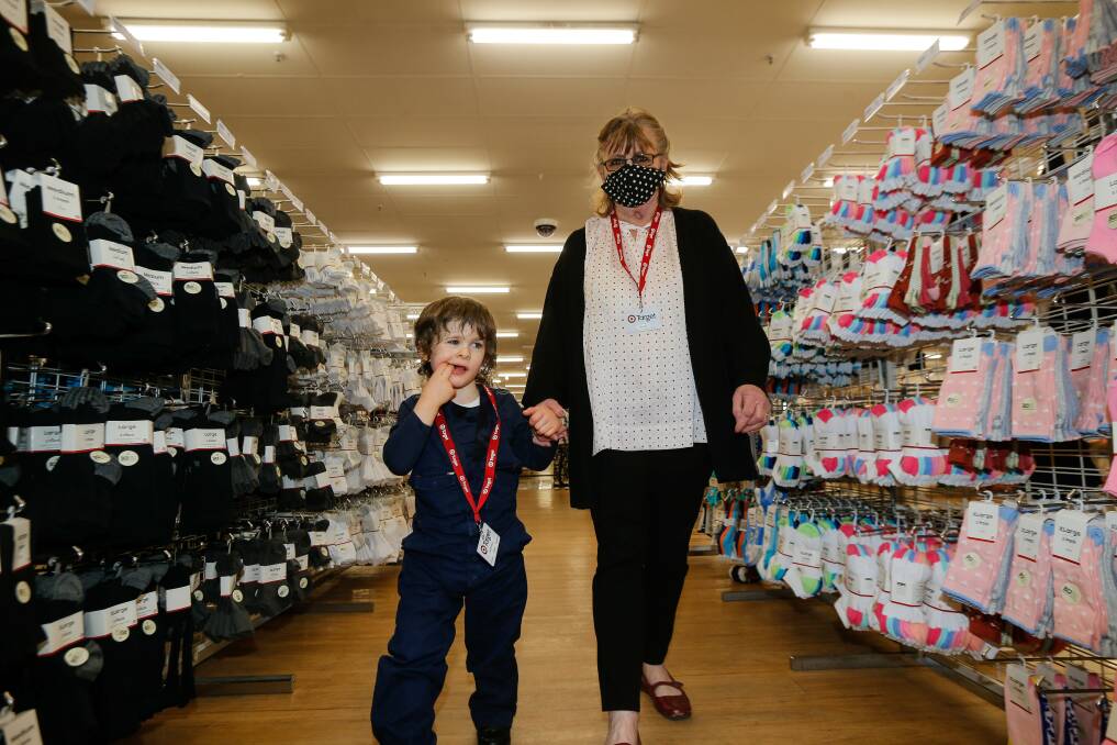 TEAM: Marshall Hayhoe, 5, was made the official Target store inspector by staff member Ros Stewart. Picture: Anthony Brady