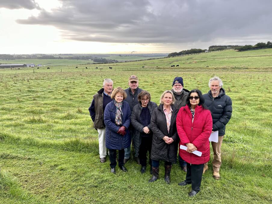Neighbours John and Jenny Ryan, Chris McGrath, Helen Bourke, Julie Luxton, Sapna Mitra, Geoff Spencer and Garry Druitt wanted a mobile phone tower on Hopkins Point Road to be moved closer to the housing development that needed it.