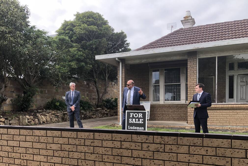 PASSED IN: Auctioneer Bruce Ludeman attempts to get bidding under way at the Liebig Street house which was later passed in.