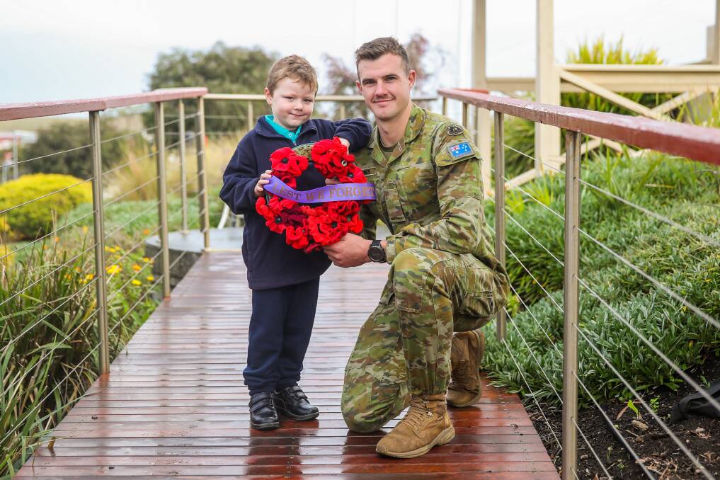 TWO MATES: Five-year-old Rykah Warner, from Warrnambool West Primary School, was speechless when he met Private Michael Barnes who is now stationed in Townsville. Picture: Morgan Hancock