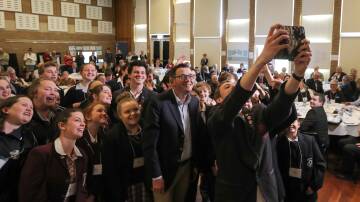 Premier Daniel Andrews gets a selfie with school students at the Great South Coast Regional Assembly in Portland in 2017.