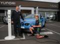 Standout: Callaghan Motors electric vehicle specialist Shane Hicks with Warrnambool College student Sam Anderson, 14, who excelled in the Industry Connection Program. Picture: Morgan Hancock