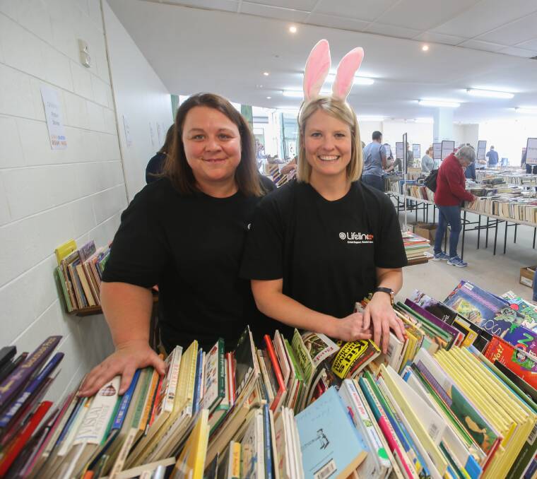 Titles galore: Lifeline Easter Book Fair volunteer Tania Ferris and LifeLine's Bess Slater work to keep the book supply up and organised. Picture: Amy Paton
