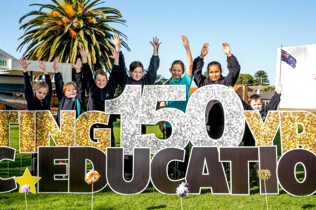 Proud: Warrnambool West Primary school Maddie Rylance, Sienna Peirson, Jacko Dewitt, Lucas Parsons, Tealy Lynn, Pavi Kaur and Casey Barrett celebrate 150 years of public education on Warrnambool's Civic Green. Picture: Chris Doheny