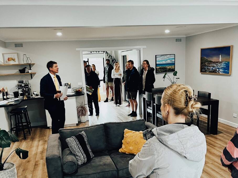 Wet weather on Saturday forced the auction of a three-bedroom home at 47 Whites Road indoors. The home sold for $587,000. 