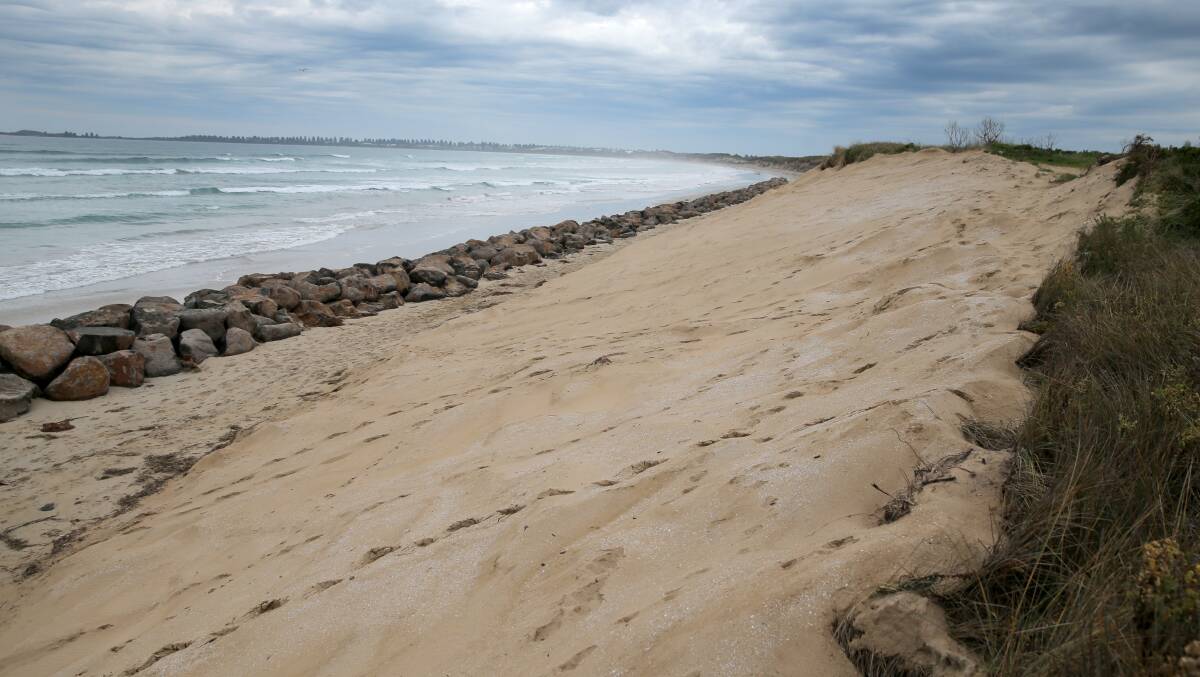 Buried rubbish: The extended rock wall and the rebuilt sand dune covers the former East Beach tip site in Port Fairy. Picture: ROB GUNSTONE
