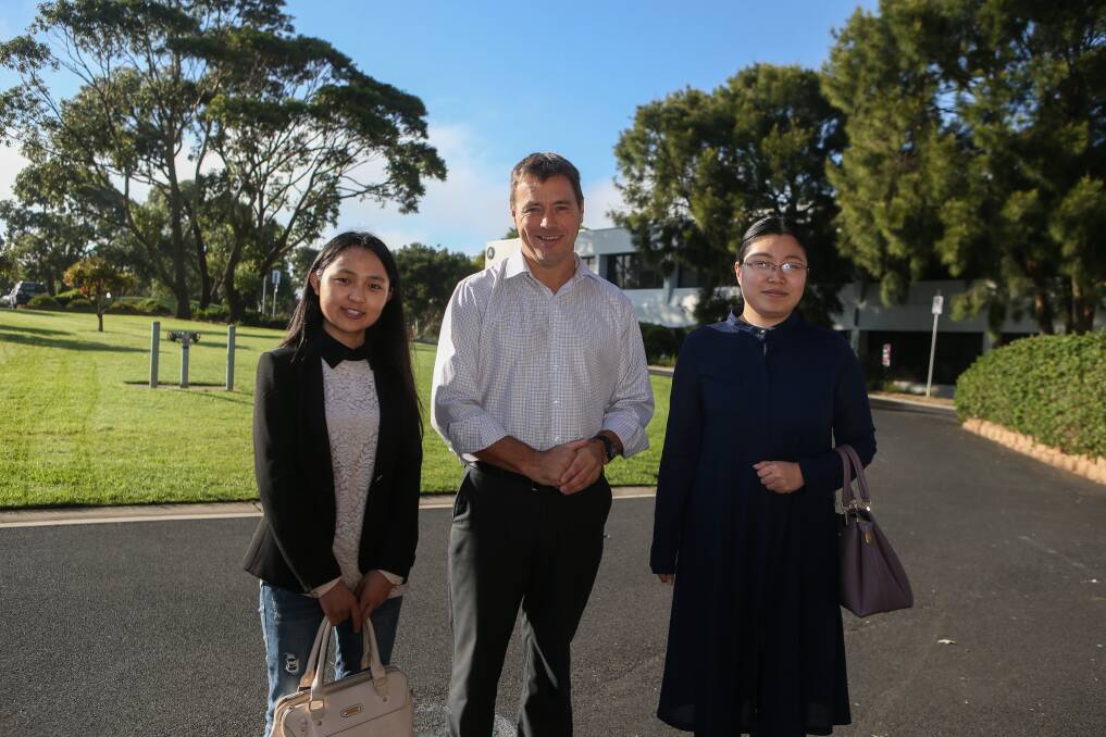 Welcome: Chinese visitors Xue Shen and Ming Hu with Deakin University Warrnambool campus director Alistair McCosh.