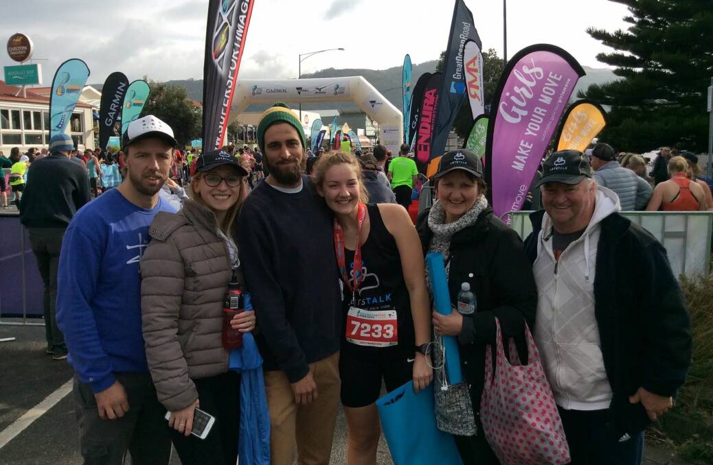 Support: Molly Smith celebrates finishing the Great Ocean Road half marathon with her family and partner Daniel. She said she felt amazing after completing it.