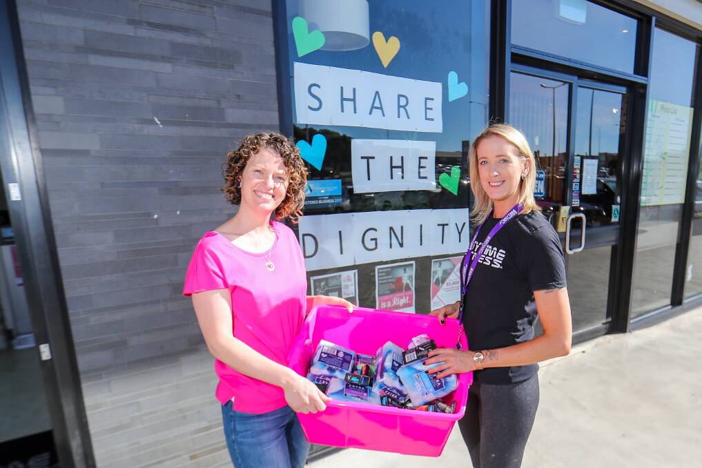 Help: Share the Dignity Warrnambool team leader Narelle Hill with Anytime Fitness Warrnambool manager and Share the Dignity volunteer Jade Thwaites show their support for the sanitary collection drive which runs until the end of April. Anytime Fitness is one of the collection points. Picture: Morgan Hancock

