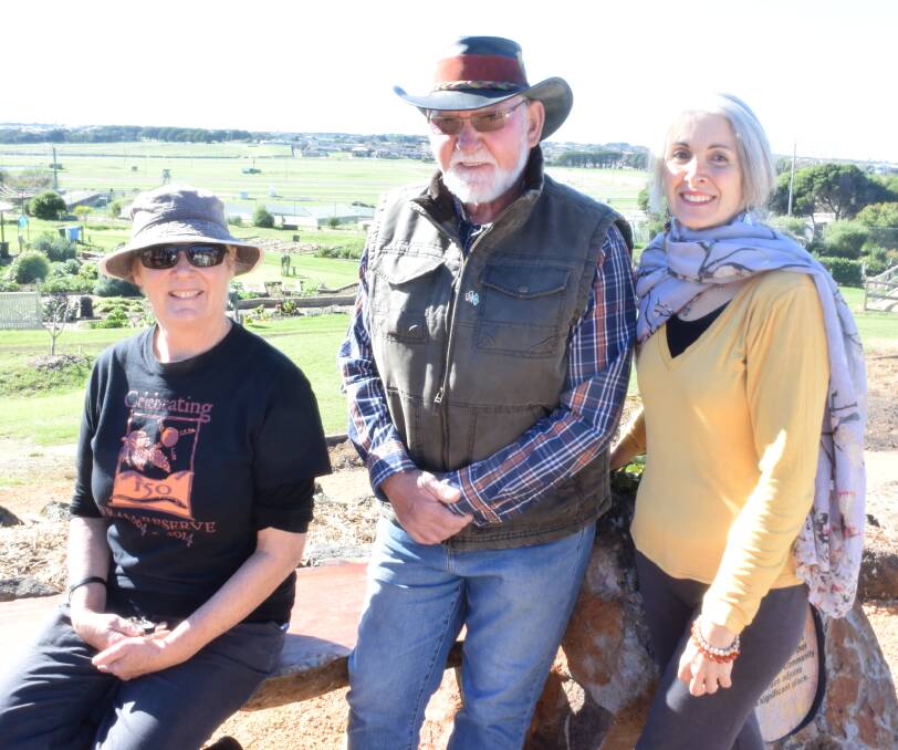 Special: Warnambool Community Garden convenor Julie Eagles, indigenous elder Rob Lowe Senior and artist Elly Heesakkers-Rollinson who designed the seat. Picture: Madeleine McNeil