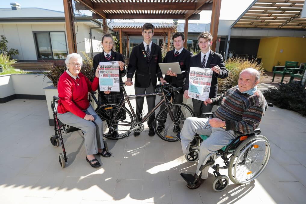 Fun: Mercy Place residents Yvonne Edey and Colin Lee and Emmanuel College students Georgina Rankin, Fraser Williamson-Loft, Wil Johnson and Hayden Prout, all 17, support a new Cycling Without Age program. Picture: Morgan Hancock