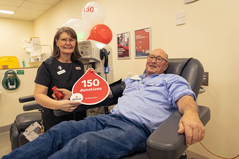 Warrnambool Blood Donor Centre's Tracey Dean with Broadwater's Philip Baulch who made his 150th blood donation on Thursday. Picture by Sean McKenna
