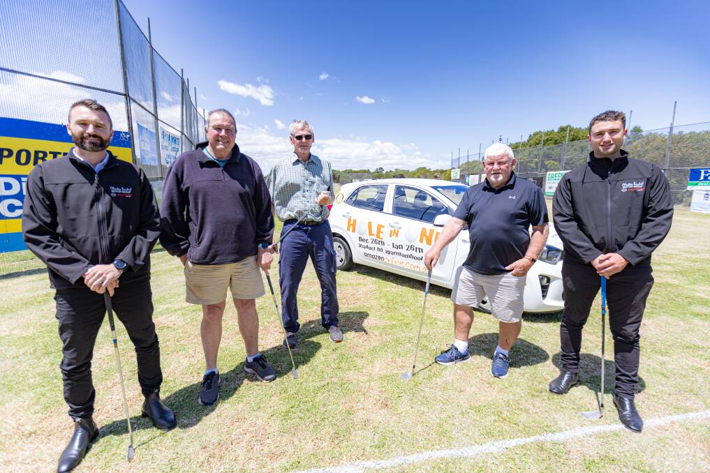Clinton Baulch Motor Group's Ben Hogan (left) and Dalton Barby (right) with Warrnambool East Rotary Club's James Cowell (second from left), Peter Reeve and Mike Toone and Dalton Barby at the annual hole-in-one competition. Picture by Eddie Guerrero.
