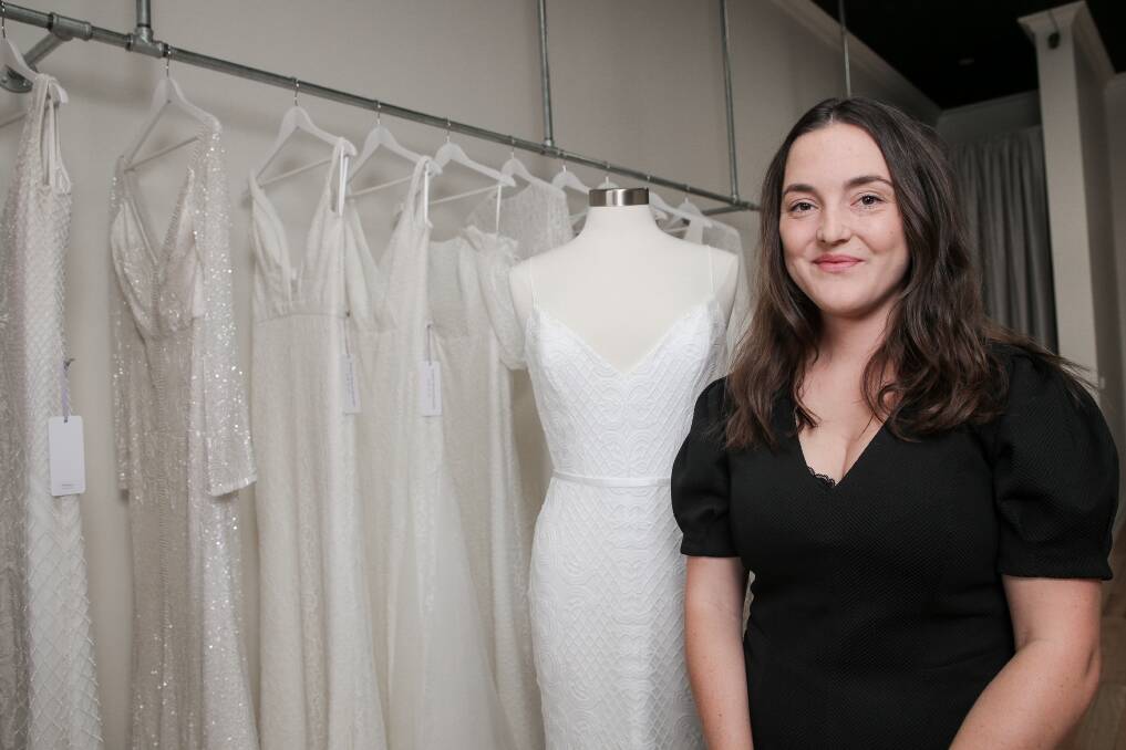 White wedding: Ivory Bride owner Kayla Retallack with some of the Karen Willis Holmes gowns which are now available in the south-west. The Liebig Street store's opening on Friday will mark the beginning of a dream come true for its young owner. Picture: Christine Ansorge


