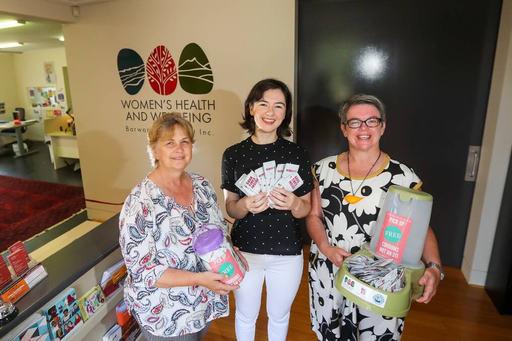 Bigger message: Women's Health and Wellbeing Barwon South West staff Toni Ryan and Alex Tyler and chief executive Emma Mahony pictured with condoms that are available from Port Fairy businesses during the folk festival. Picture: Morgan Hancock