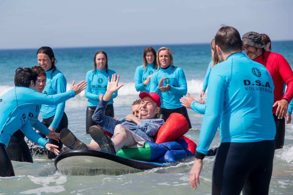 Fun for everyone: Warrnambool's Bob Paliouras has a ball at last year's all-abilities surf day. Picture: Christine Ansorge