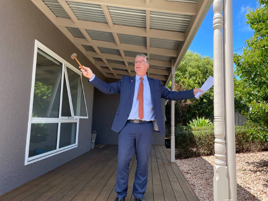 Sold: Northeast Stockdale and Leggo auctioneer Matt Northeast at the property in McConnell Street which sold at auction for $1,030,000 on Saturday. 