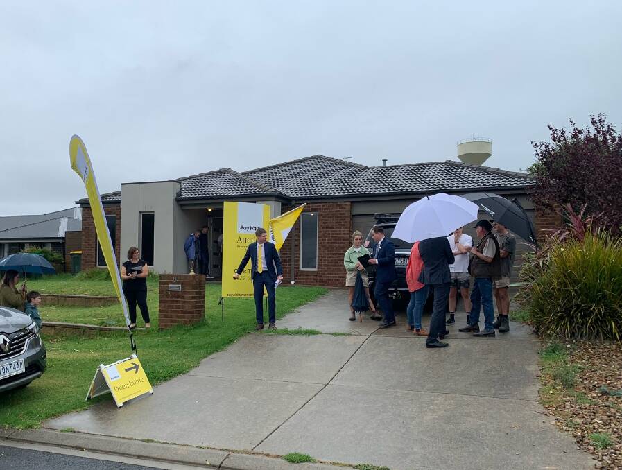 Ray White Warrnambool auctioneer Fergus Torpy at 8 Cole Close in Dennington. The three-bedroom property sold for $580,000 on Saturday. Picture supplied